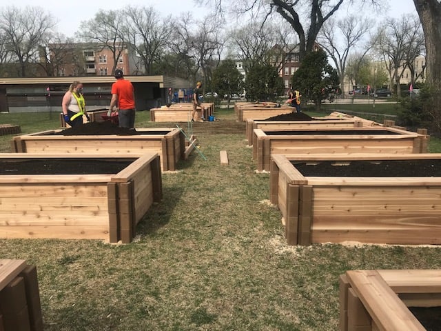 Volunteers work at Vimy Victory Garden Build