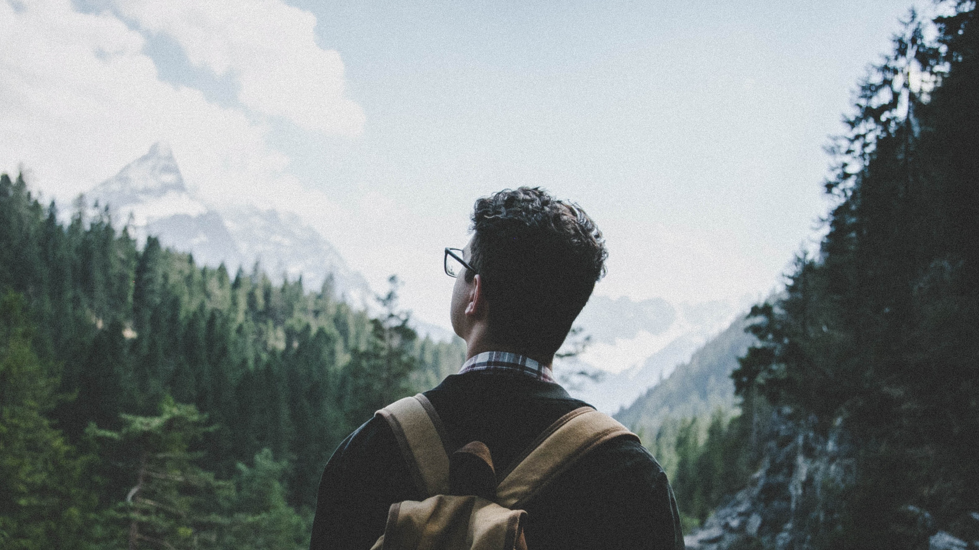 Man in front of a mountain