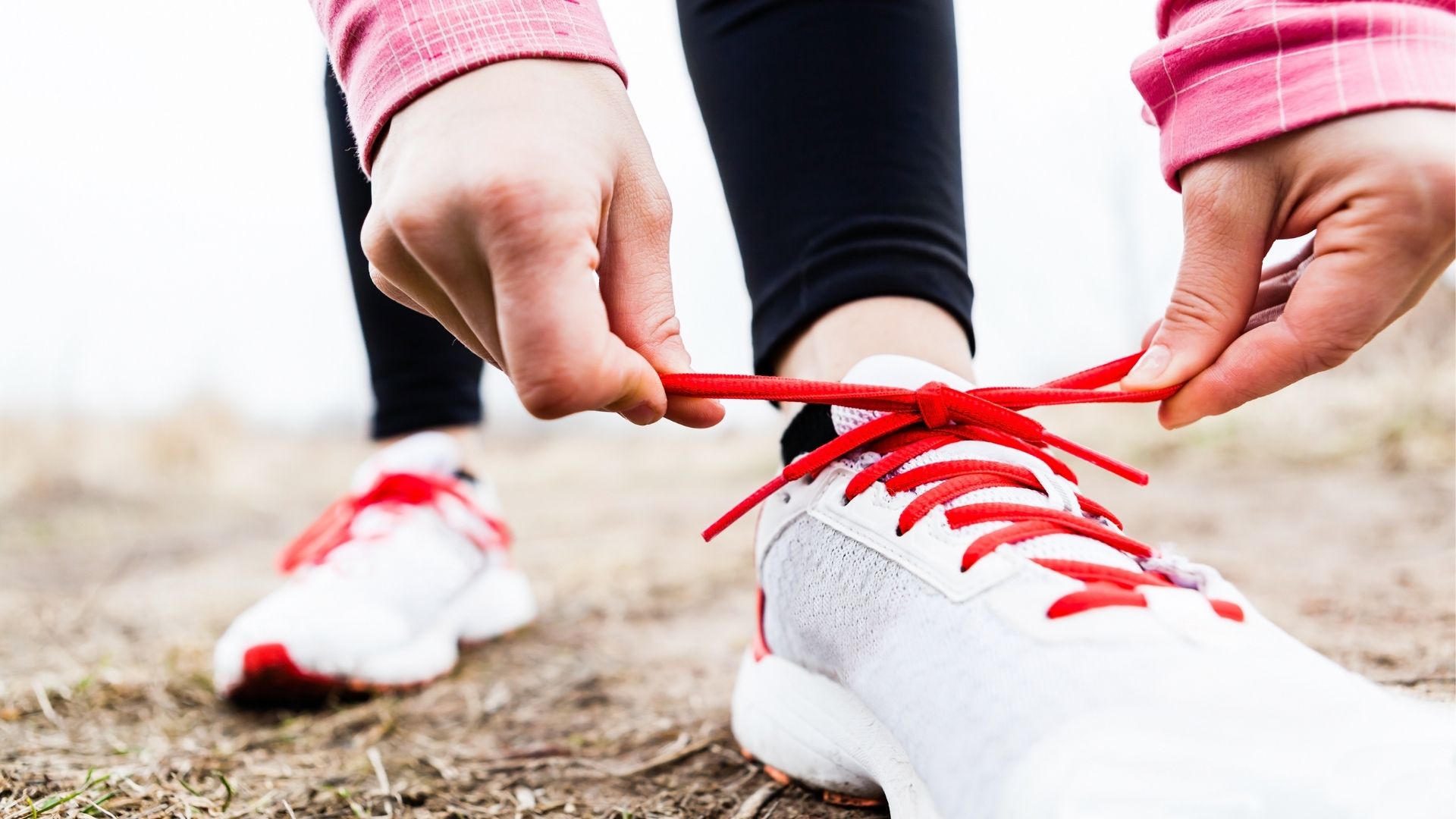 person tying shoe