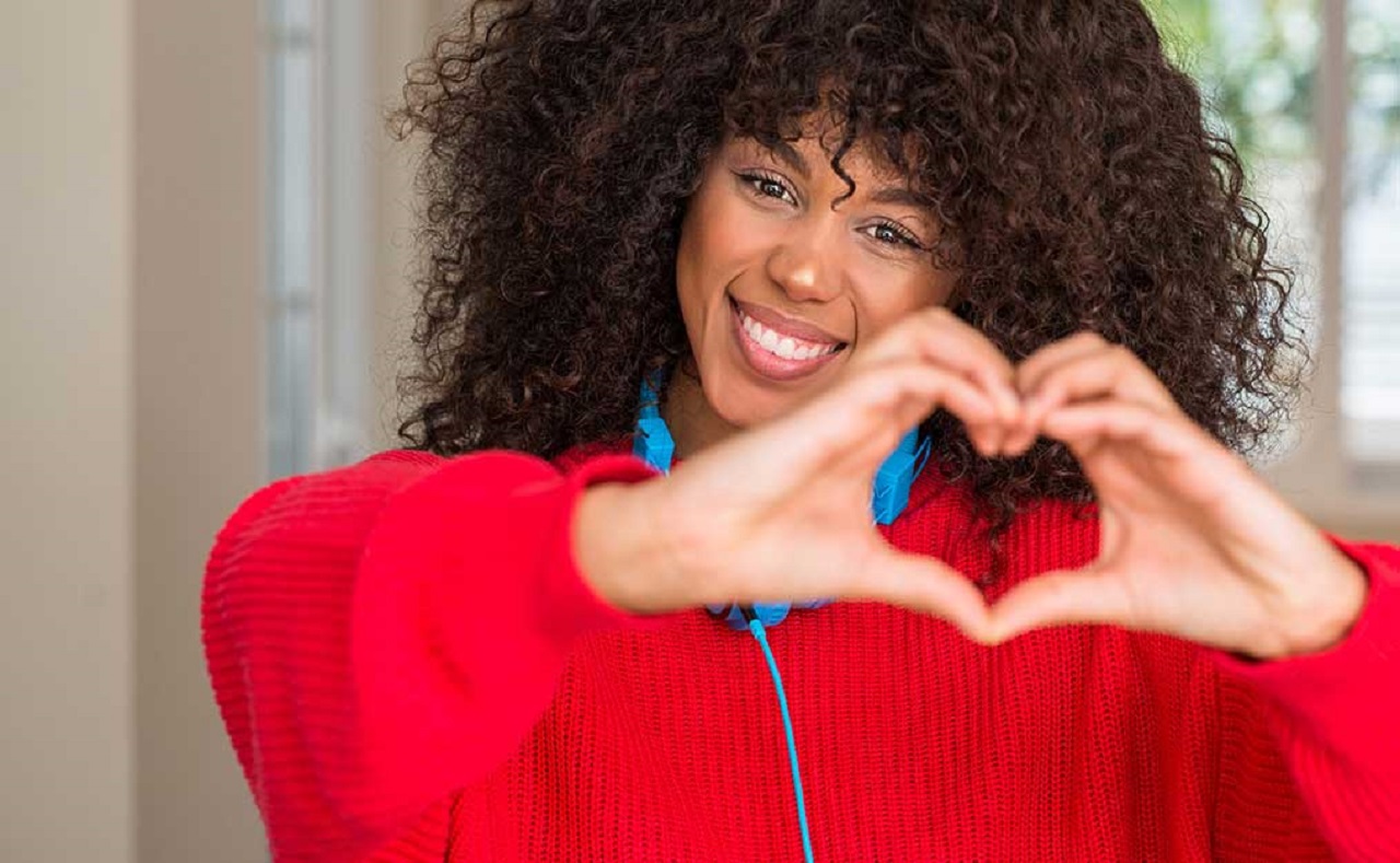 woman making heart hands