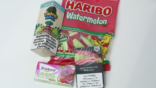 A picture of candy and flavored tobacco products side by side